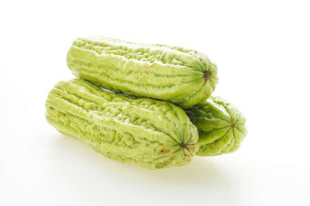 Bitter melon vegetables isolated on white backgroundの写真素材