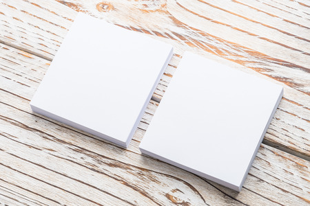 Blank white paper mock up on white wood background - filter effectの写真素材