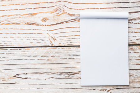 Blank white paper mock up on white wood background - filter effectの写真素材