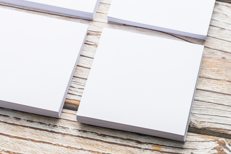 Blank white paper mock up on white wood background - filter effectの写真素材