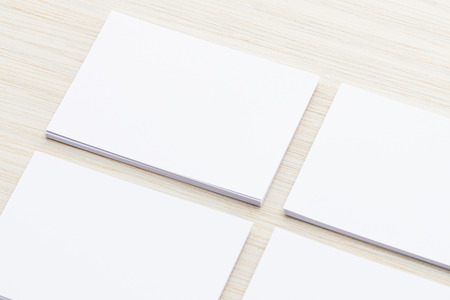 White paper mock up on wood background