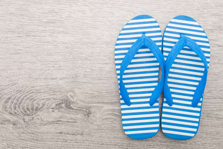 Flip flop on wooden backgroundの写真素材