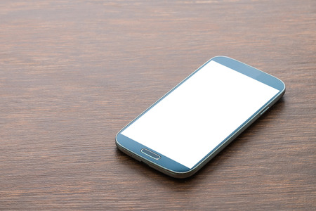 Moblie smart phone on wood backgroundの写真素材