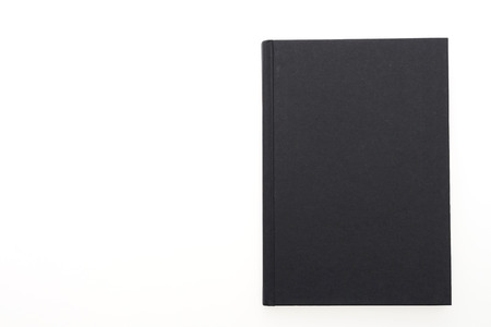 Black note book paper isolated on white backgroundの写真素材