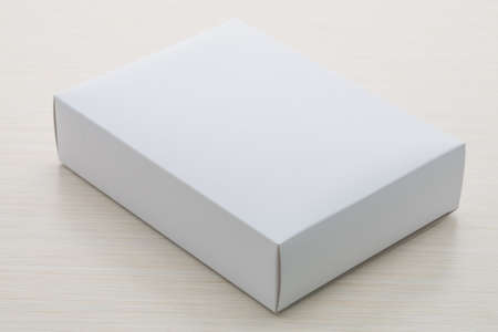 Paper box on wood background