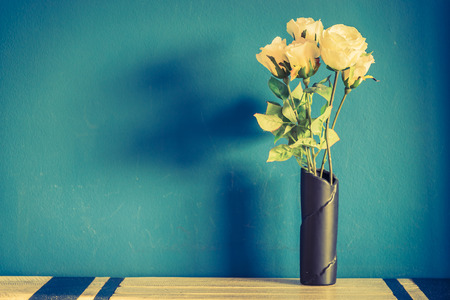 White flower in vase with copy space - vintage filterの写真素材