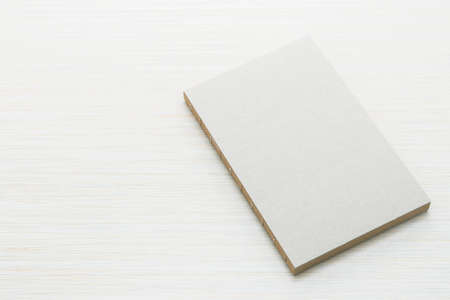Blank notebook mock up on wood backgroundの写真素材