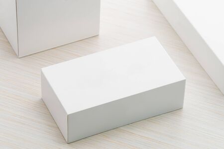 White box mock up on wooden backgroundの写真素材