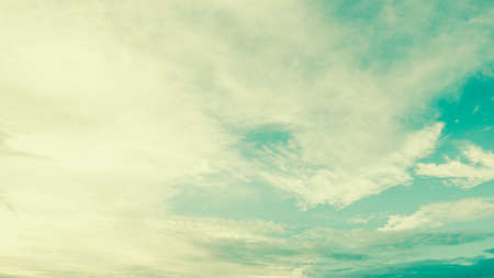 White cloud on blue sky - vintage filter effectの写真素材