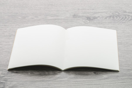 Blank Note book mockup on wood backgroundの写真素材