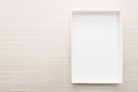 White box mock up on wooden backgroundの写真素材