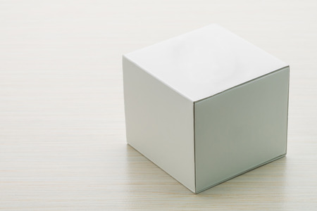 White box mock up on wooden backgroundの写真素材