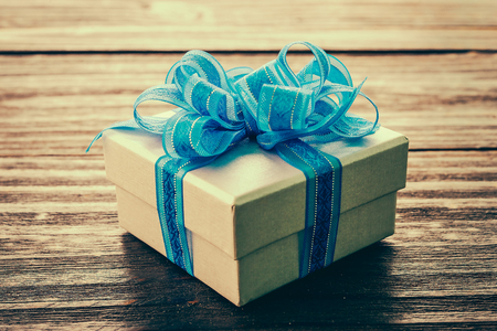 Gift box on wood background - vintage effect style picturesの写真素材