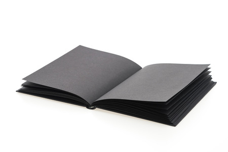 Black note book paper isolated on white の写真素材