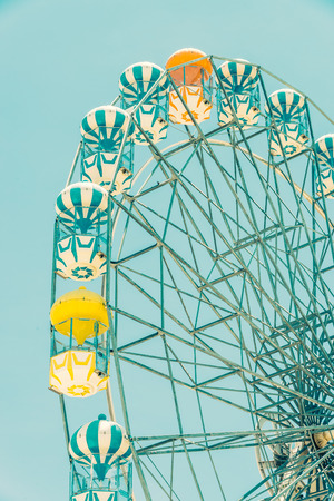 Vintage ferris wheel in the park - vintage filter effectの写真素材