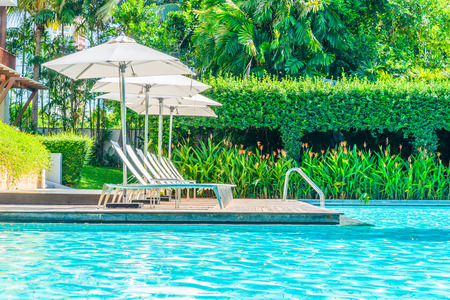 Umbrella with chair in hotel  swimming pool resortのeditorial素材