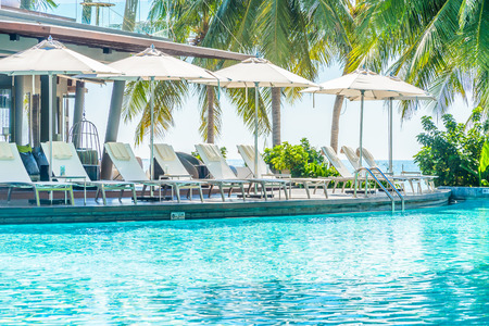Umbrella with chair in hotel  swimming pool resortのeditorial素材