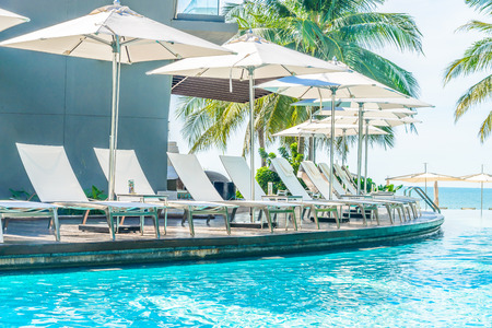 Umbrella with chair in hotel  swimming pool resortのeditorial素材