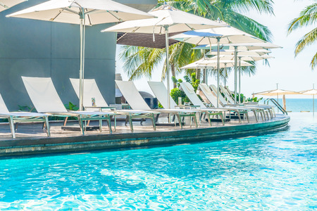 Umbrella with chair in hotel  swimming pool resortのeditorial素材