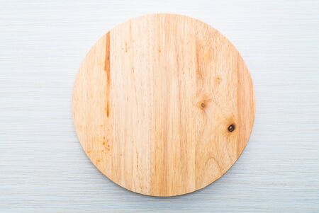 Wood cutting board on wooden textures backgroundの写真素材
