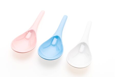 Plastic ladle spoon isolated on white backgroundの写真素材