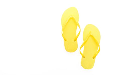 Yellow flip flops isolated on white backgroundの写真素材