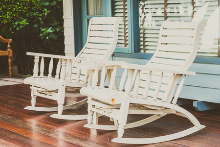White wood chair on terrace - vintage filter effectの写真素材