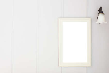 Blank frame on white wall backgroundの写真素材