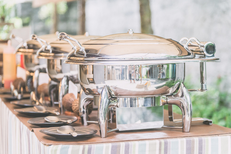 Selective focus point on Catering buffet food in restaurant - Light vintage filter effectの写真素材