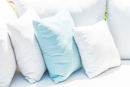 Pillow on sofa bed with outdoor viewの写真素材