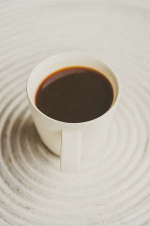 Selective focus point on black coffee in white cup - vintage filter effectの写真素材