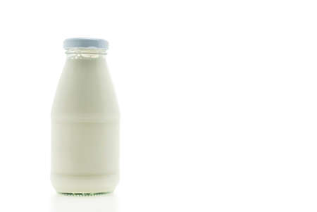 Milk bottle glass isolated on white backgroundの写真素材