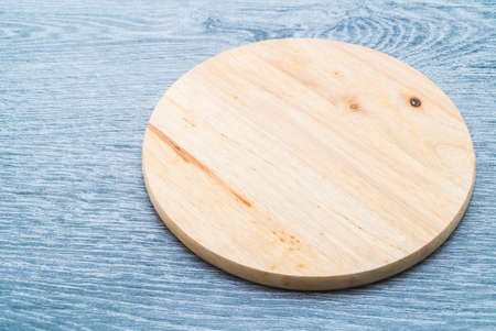 Wood cutting board on wooden textures backgroundの写真素材