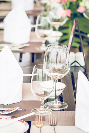 Table dining set in the hotel restaurant - light vintage filter effect processing style pictures - Selective focus pointの写真素材