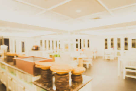 Abstract blur interior restaurant background - vintage light filter effectの写真素材