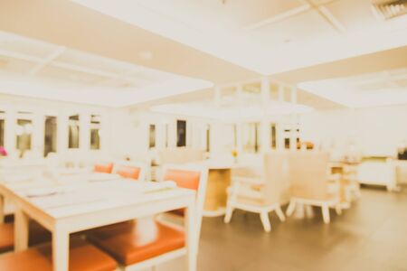 Abstract blur interior restaurant background - vintage light filter effectの写真素材