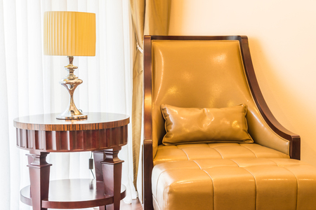 Sofa with pillow and light lamp decoration in living room interiorの写真素材