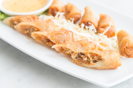 Fried spring rolls in white plate