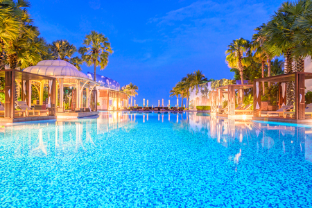 Outdoor Swimming pool in hotel resort at night - Long speed shutterの写真素材