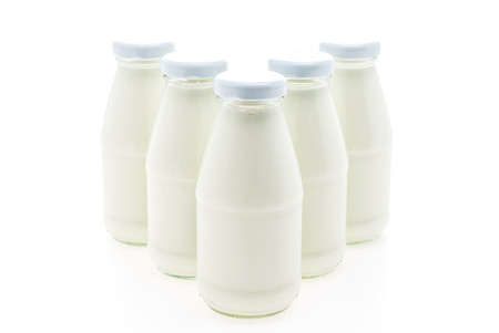 Milk bottle glass isolated on white backgroundの写真素材