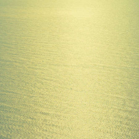 Vintage sea water background with sunflare light from sun - Vintage filter effectの写真素材