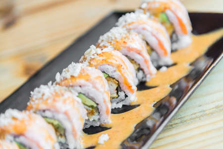 Selective focus point Salmon sushi roll - japanese food style