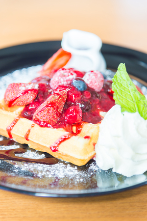 Strawberry and mix berry with waffle - selective focus pointの写真素材