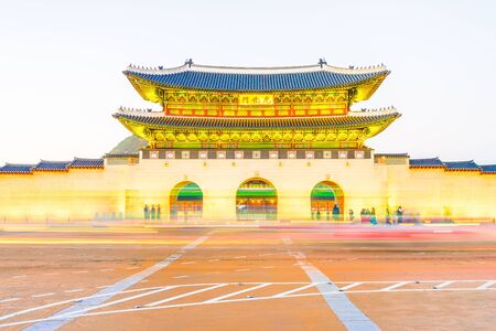 Beautiful Architecture in Gyeongbokgung Palace at Seoul city Korea at Twilight time with night light from traffic carのeditorial素材