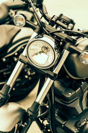 Selective focus point on vintage headlight lamp motorcycle - Vintage filter Processingの写真素材