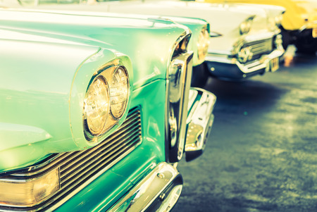 Selective focus point on Headlight lamp car - vintage filterの写真素材
