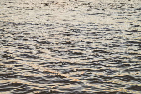 Sea water background with sun flare