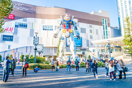 TOKYO, JAPAN - November 27,2015 : Gundam Statue Model Performances Outside DiverCity Tokyo Plaza, Odaiba, Tokyo, Japan. It is 18m of tall and is the tallest replica of famous robot, Gundam.のeditorial素材