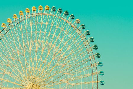 Vintage ferris wheel in the park at Japan - Vintage filter effectの写真素材