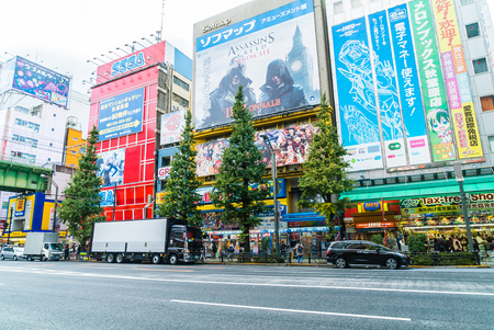 TOKYO, JAPAN - November 26, 2015: Crowded people traffic passes with colorful signs at Akihabara. The electronics and Toys district in Tokyo Japan.のeditorial素材